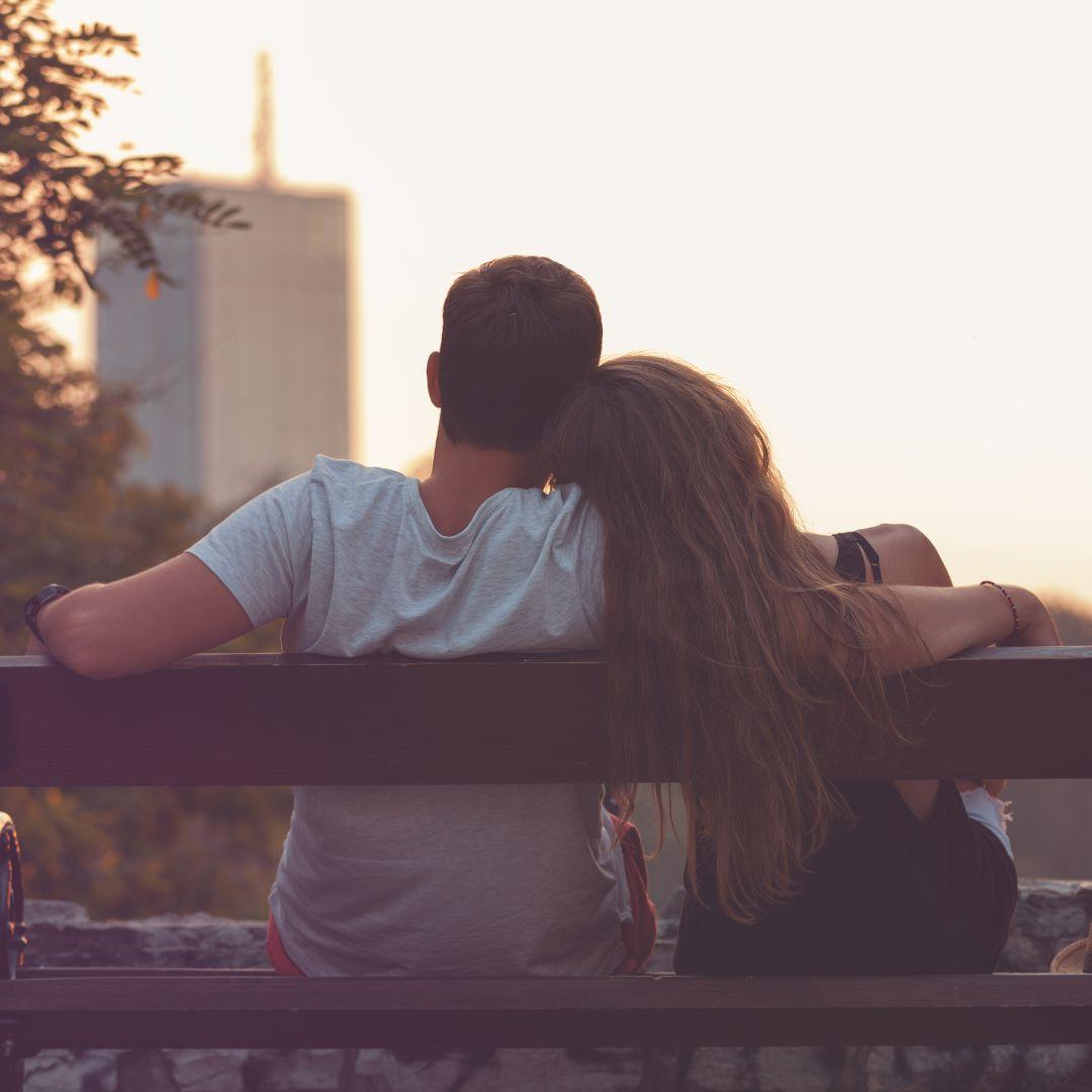 couple siting on a bench